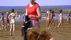 Young nudist undressing beach