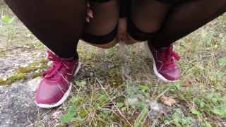 Girl in black stockings pissing