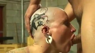 Tattoed pierced bald head slut nailed