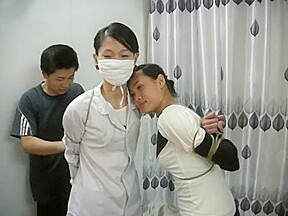Two Chinese Girls Tied, One Wearing Cloth Mask